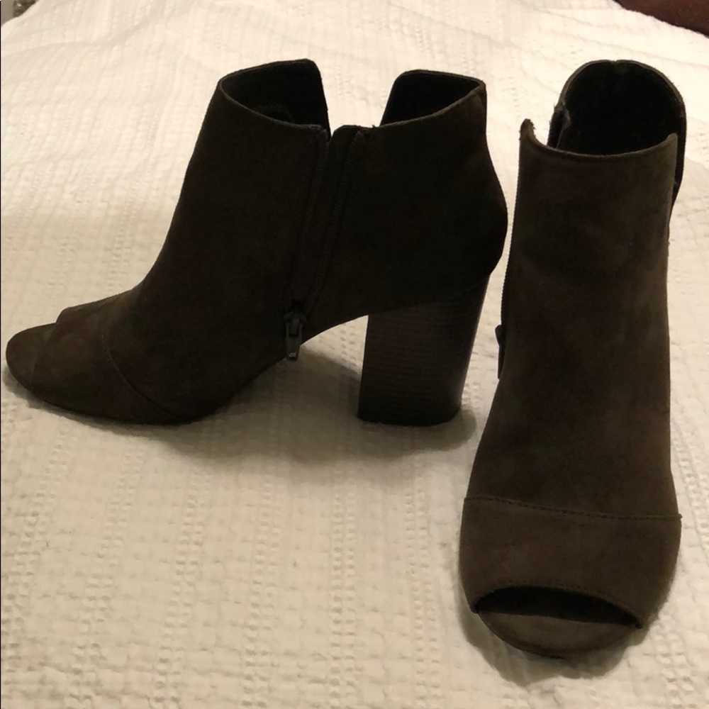 Open toe green boots.